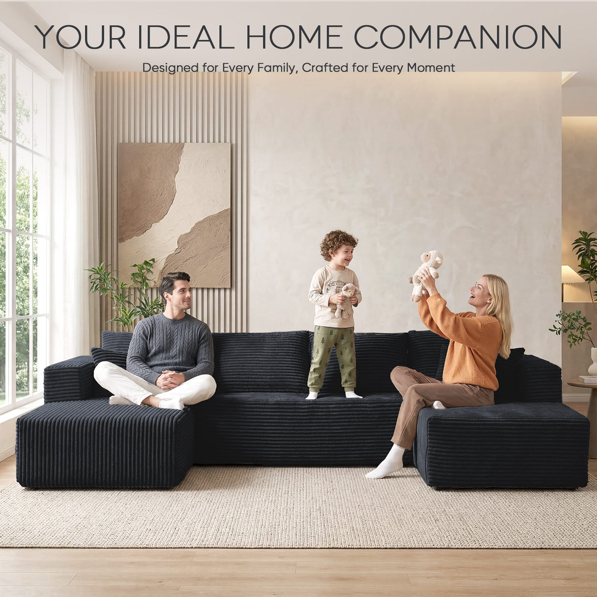 [Black] corduroy U-shaped sectional sofa — family lifestyle scene with parents and toddler playing on sofa in bright sunlit living room, emphasizing spacious 5-6 person seating capacity